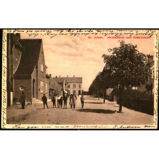  Nr. Alslev - Jernbanevej med Bankfilialen - L.P. Larsens Bogh. 41817 - Brugt